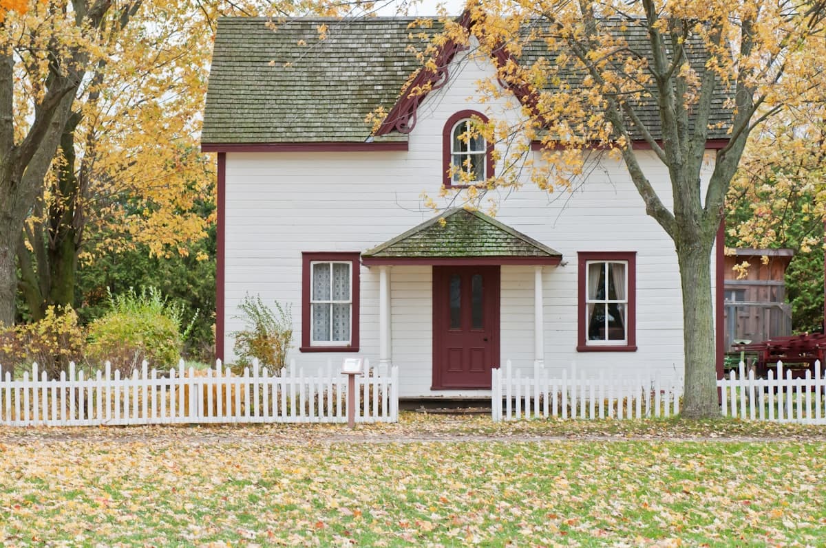 Older Victorian-style home with mature trees